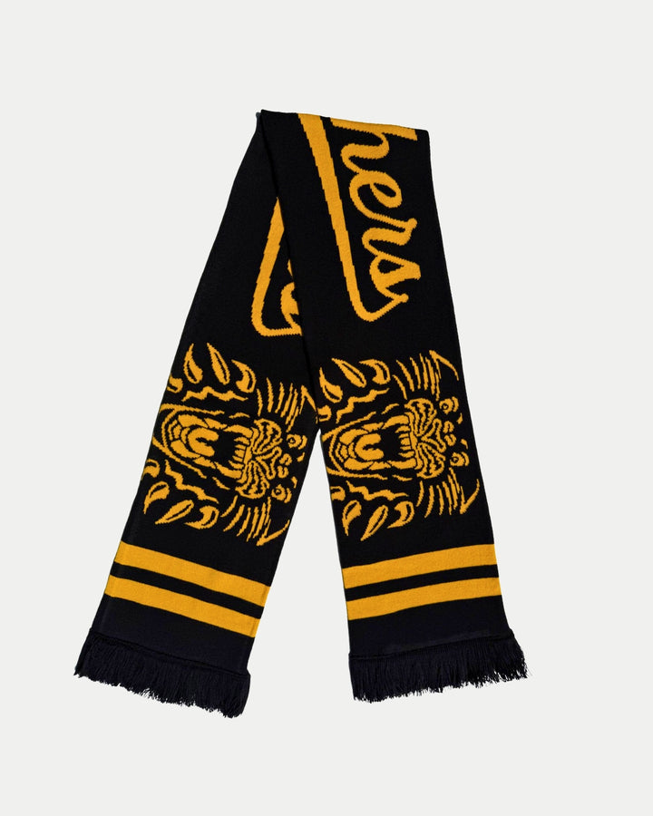 Show your team pride on game day with the 25-26 Double Head Scarf from Panthersland—a black scarf with yellow stripes, fringed ends, and Panthers in yellow script, featuring a roaring tiger illustration.