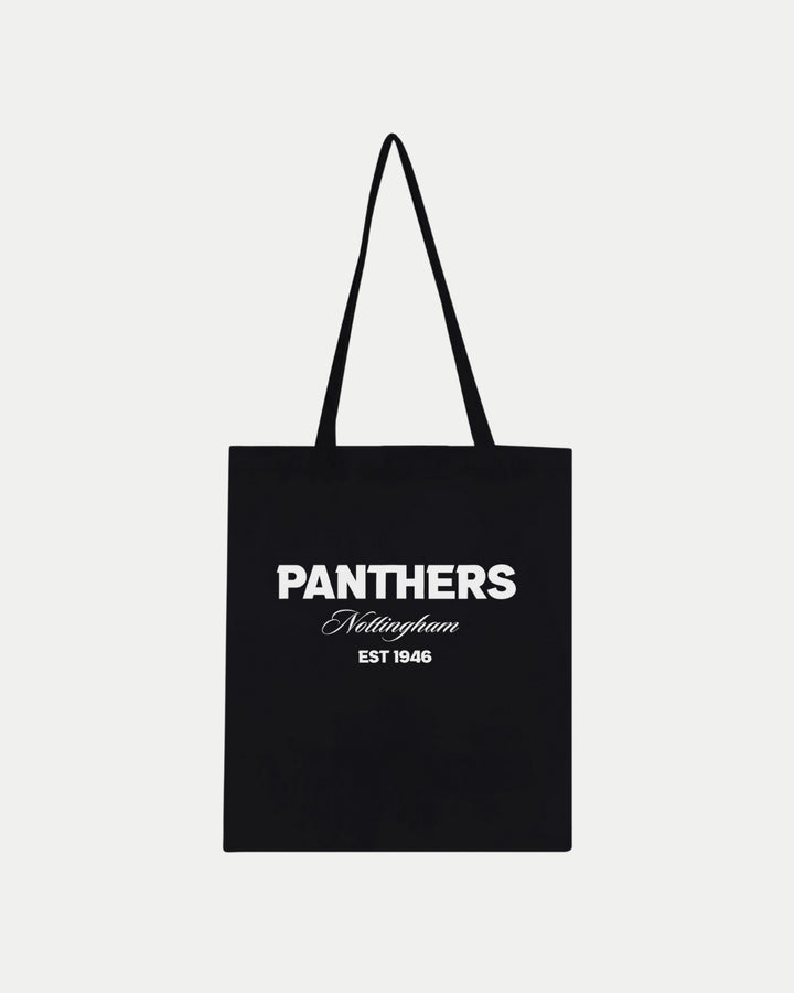 The Made-To-Order Panthers Est 1946 Tote Bag Black by Nottingham Panthers is a black 100% cotton tote with two handles and PANTHERS Nottingham EST 1946 in white text on the front. Plain white background.