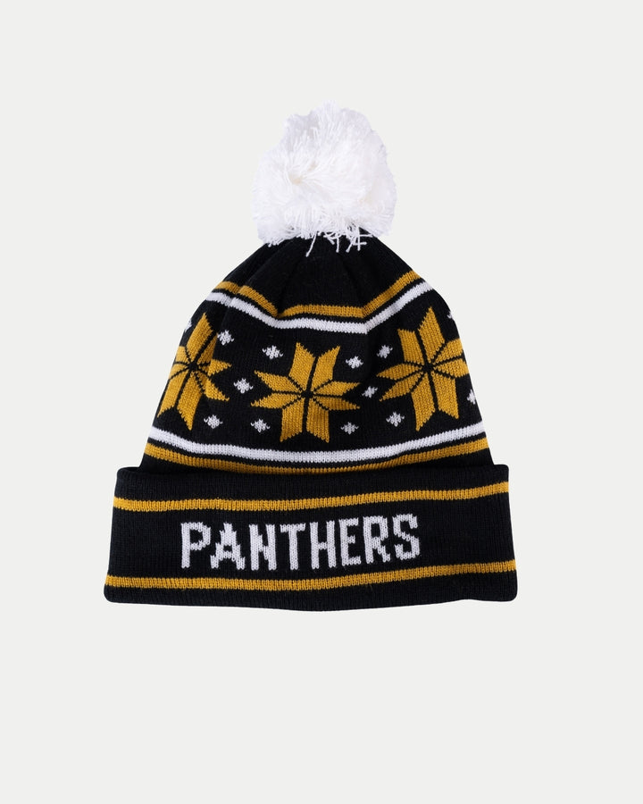 The Nottingham Panthers Gold Snowflake Pom Knit is a winter beanie featuring black and yellow snowflake patterns, a white pom-pom, and PANTHERS boldly across the front.