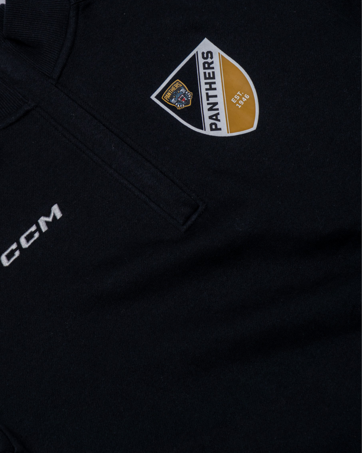 The Panthersland Nottingham Panthers 25-26 CCM Black Quarter Zip features a CCM logo and chest crest with “PANTHERS,” a gold and white panther emblem, and “EST. 1946” on the front.