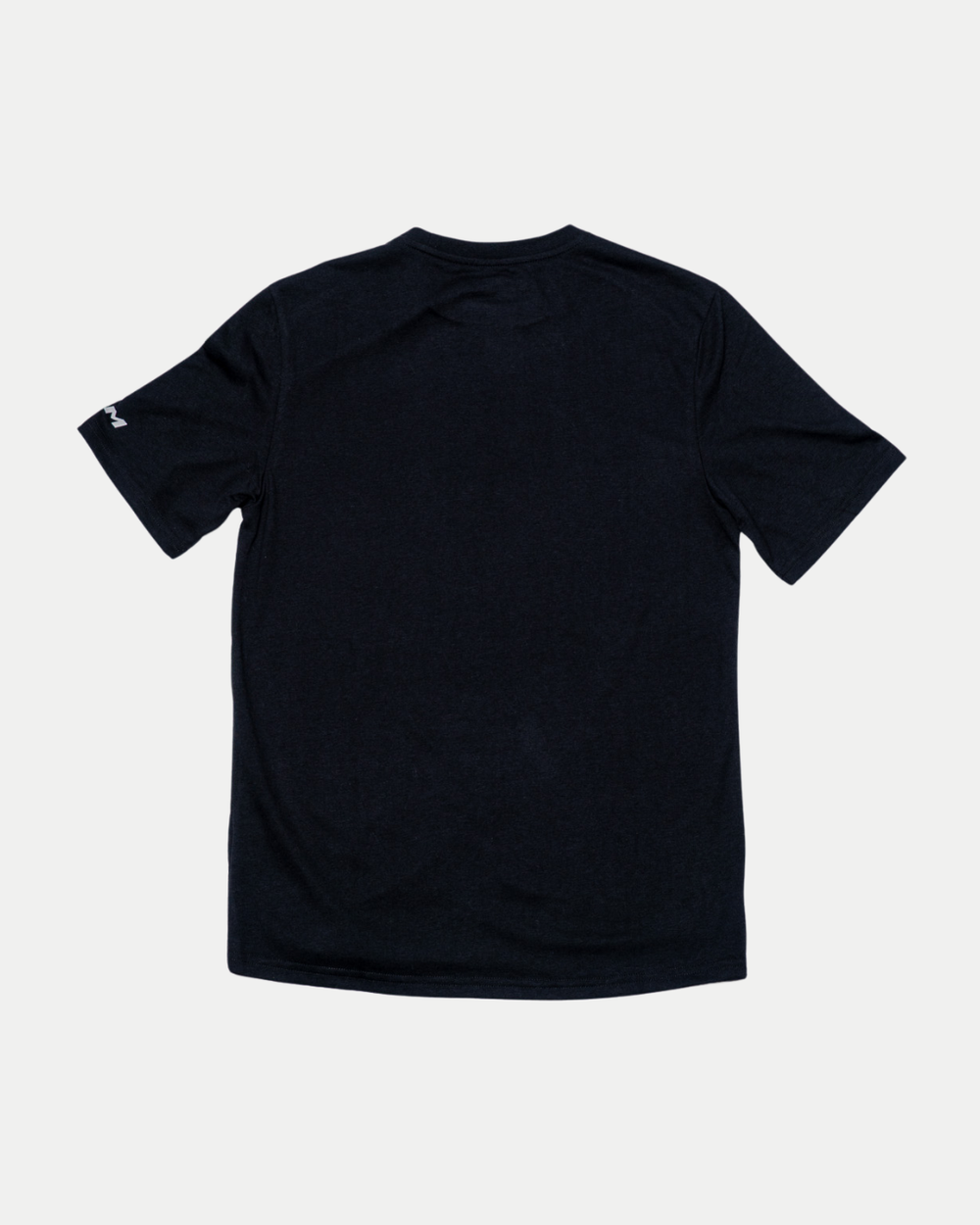 The Nottingham Panthers 25-26 CCM Black White Crest T-Shirt by Panthersland is shown from the back, laid flat on a light gray background, with a small white logo on the right sleeve near the hem.