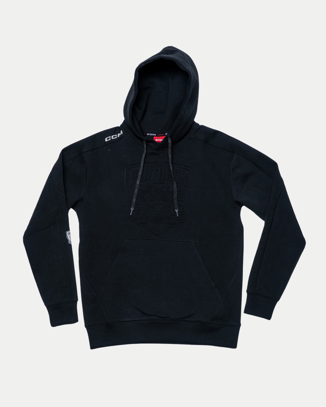 The Nottingham Panthers 25-26 CCM Black Embossed Hoodie by Panthersland features a front pocket, drawstrings, subtle embossed chest logo, a white CCM logo on the left shoulder, and a patch on the right sleeve.