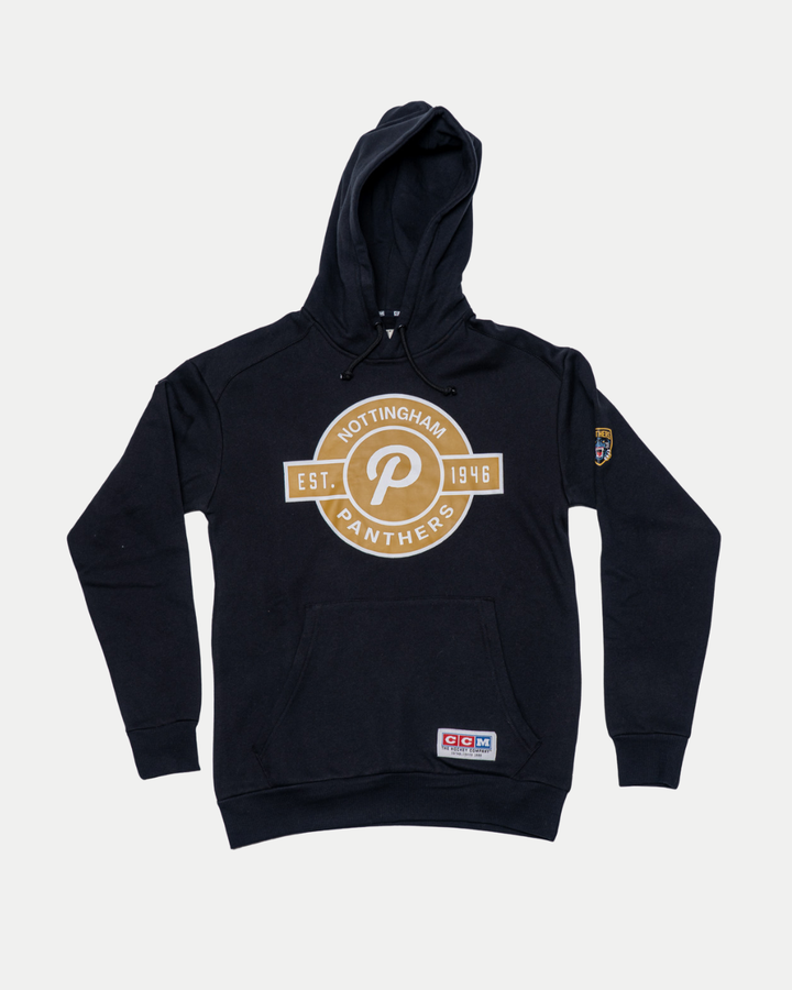 The Panthersland Nottingham Panthers 25-26 CCM black pullover hoodie features a bold gold and white team logo with “EST. 1946” on the front, a badge on the left sleeve, and a patch by the waistband.