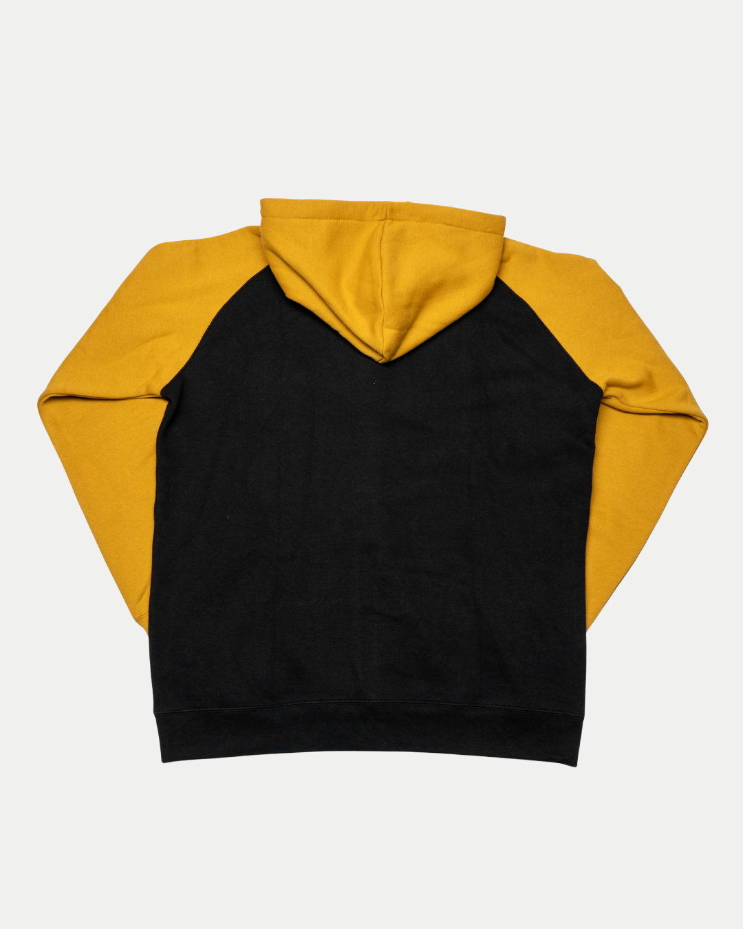 The Panthersland Nottingham Panthers 25-26 NP Logo Zip Hoodie features yellow sleeves and hood, a black body, and a gold NP logo. Shown laid flat with the back facing up on a white background.