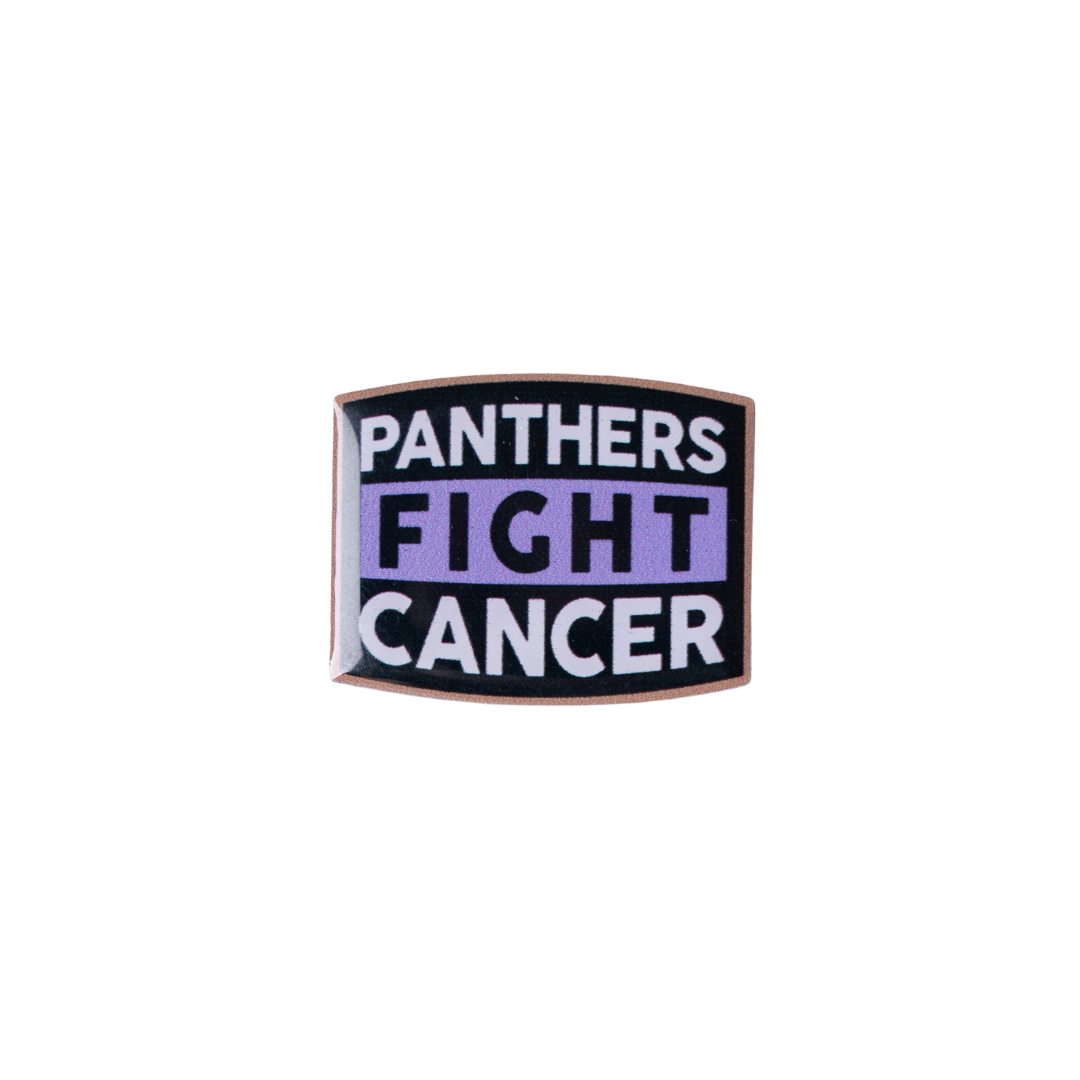 The Panthers Fight Cancer Pin Badge by Nottingham Panthers features a rectangular design with a black background, purple center stripe, and bold white and purple PANTHERS FIGHT CANCER lettering.