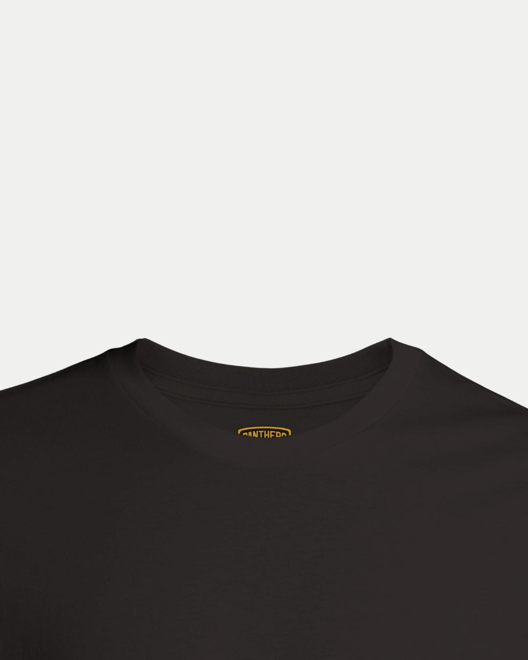 The Made To Order NP 2025 Playoff Champions T-shirt Black by Nottingham Panthers is shown on a white background, highlighting the neckline and upper chest with a small, partially visible yellow tag inside the collar.