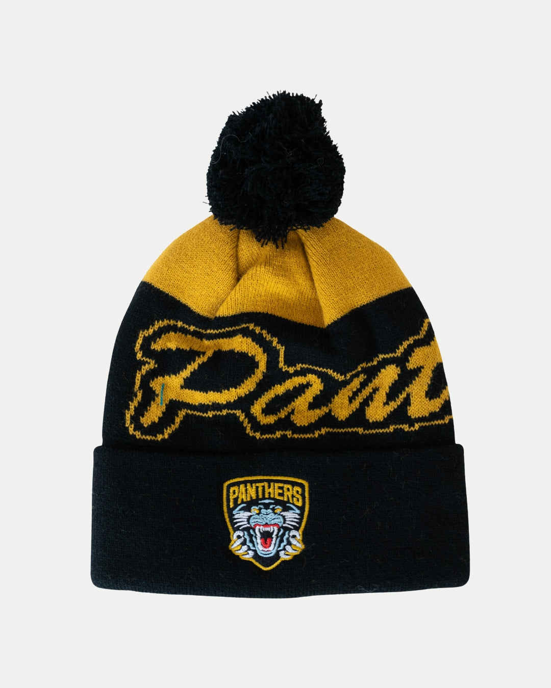 Show your team pride for the 2025-26 season with the Nottingham Panthers 25-26 Beanie Black POM by Panthersland, featuring black and yellow colors, a pom-pom, Panthers script, and a roaring panther head patch on the front cuff.