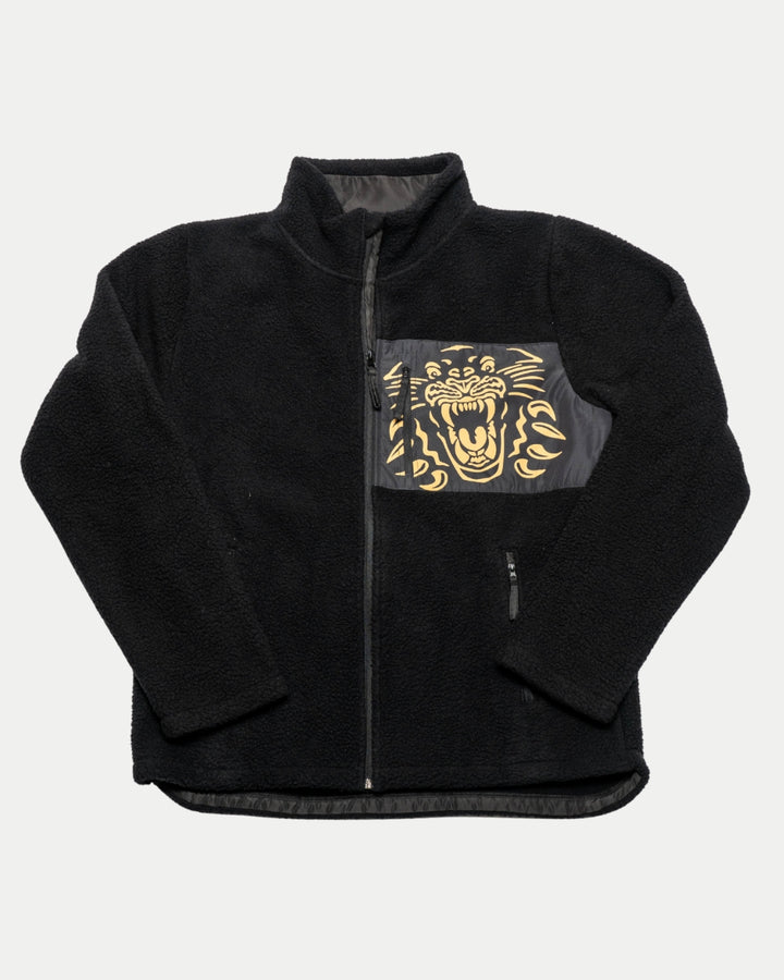 The Panthersland Nottingham Panthers 25-26 Pile Jacket is a black zip-up fleece with a standing collar and front pocket, featuring a striking golden panther graphic.