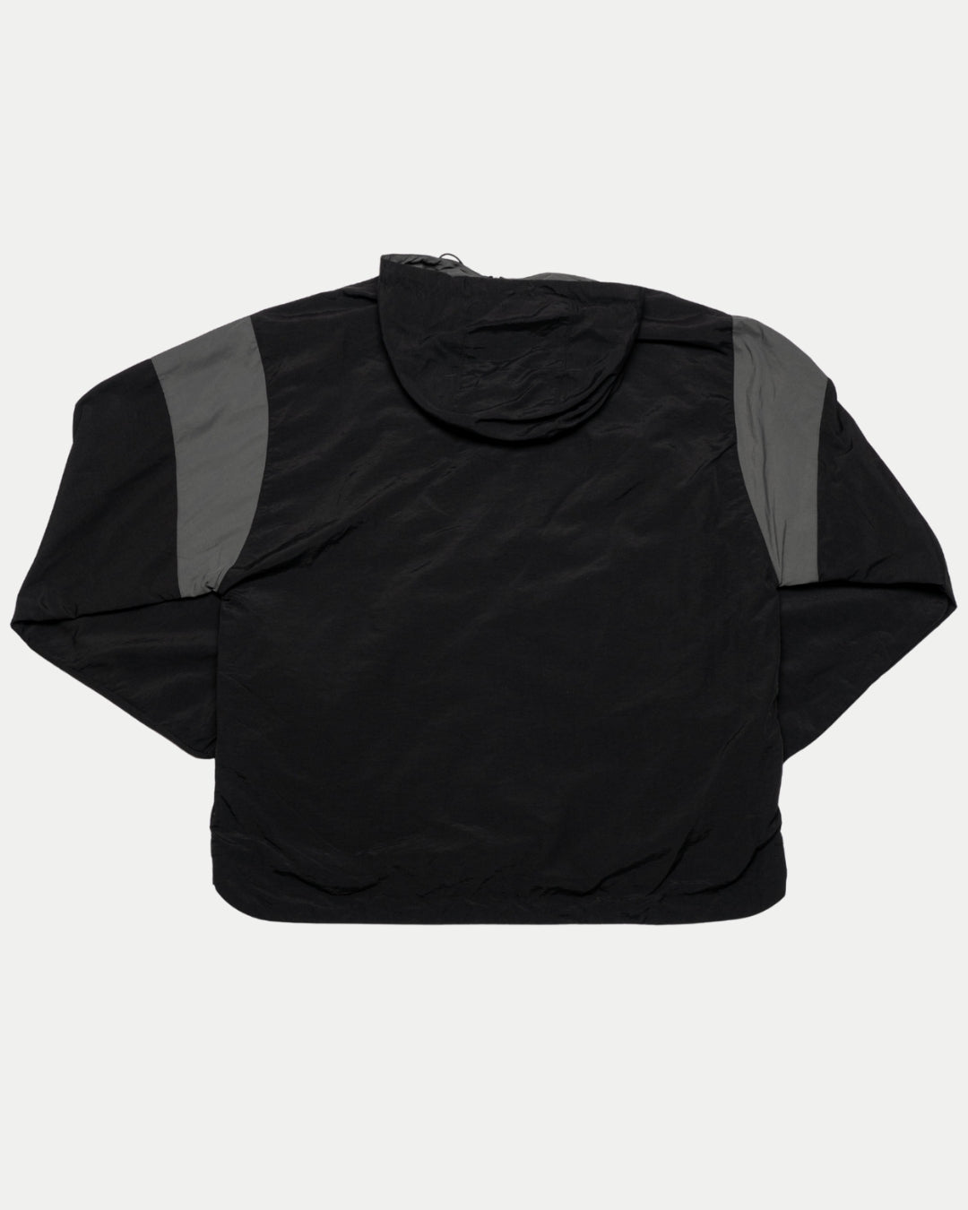 The Panthersland Nottingham Panthers 25-26 Black Anorak features dark gray shoulder panels, a hood, and a water-resistant finish—perfect for fans facing unpredictable weather. Shown flat with the back up.