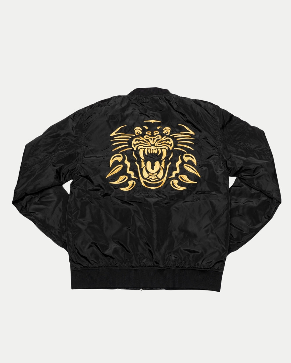 The Panthersland Nottingham Panthers Bomber Jacket 25-26 is a black jacket with a large, stylized yellow tiger face and paws graphic inspired by the iconic Panthers crest, shown on a plain white background.
