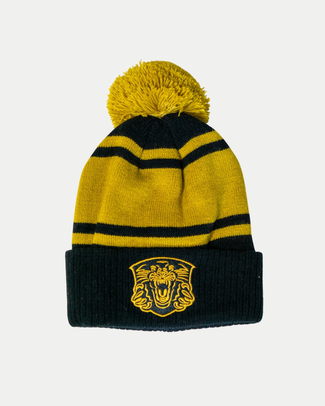 The Panthersland Nottingham Panthers 25-26 Gold Stripe Pom Knit is a winter beanie featuring black and gold stripes, a yellow pom-pom, and an embroidered roaring lion emblem on the front cuff.