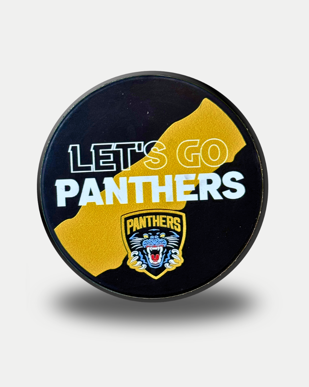 The Nottingham Panthers 25-26 Lets Go Puck by Panthersland features "LETS GO PANTHERS" text and a panther logo on a black puck with a yellow diagonal stripe.