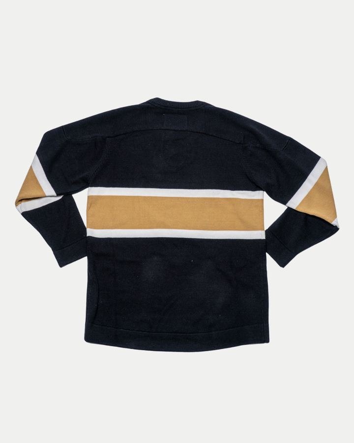 The Nottingham Panthers 25-26 CCM Gold Heritage Sweater by Panthersland features long sleeves and a wide gold stripe with narrower white stripes, shown flat with the back facing up.