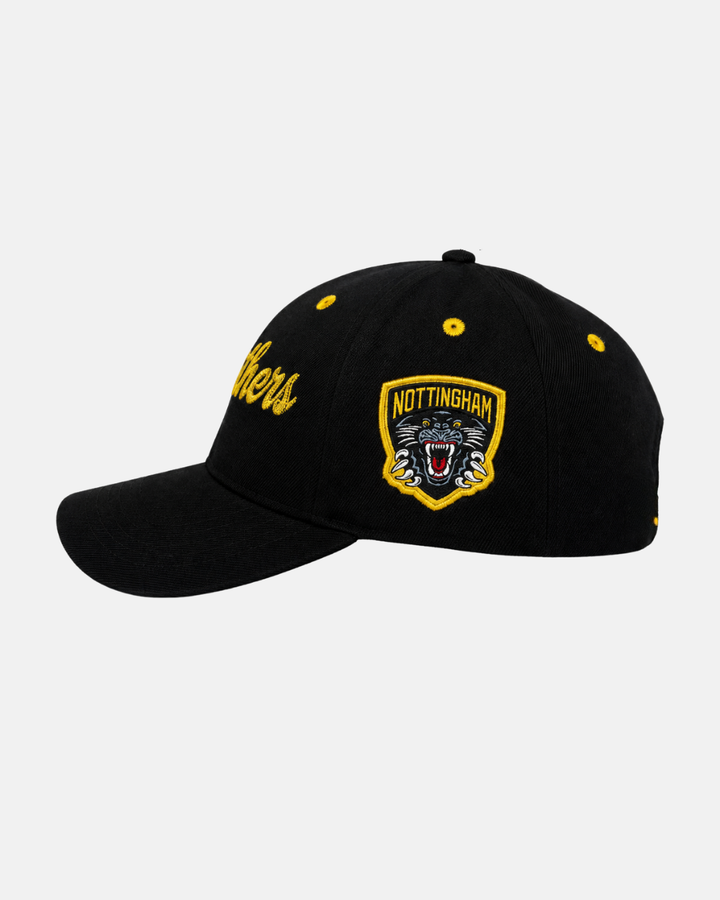 The 26-27 Kids Snapback Cap from Panthersland is a black cap featuring a yellow Nottingham Panthers badge with a roaring panther, yellow embroidered team text along the side, yellow eyelets, and a curved brim.