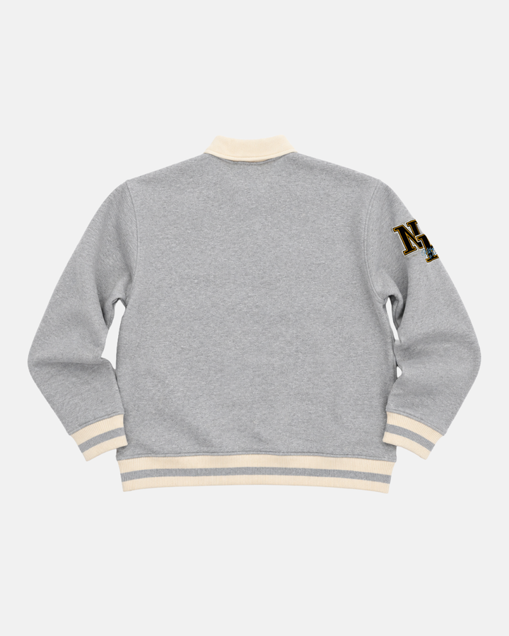 The Panthersland 26-27 Grey Crest Sweater features a gray varsity style with cream-colored cuffs, collar, and waistband—ideal for game day apparel. The back is plain, accented by an NY patch on the left sleeve.
