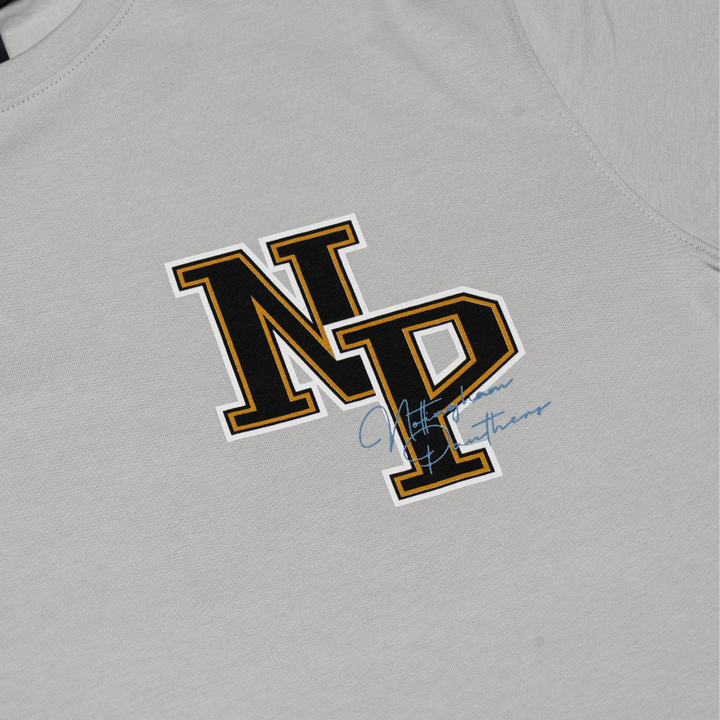 The Panthersland Kids NP Logo T-Shirt Grey features bold black-and-yellow varsity NP lettering and a small blue cursive signature, making it perfect for young fans to show their team pride.