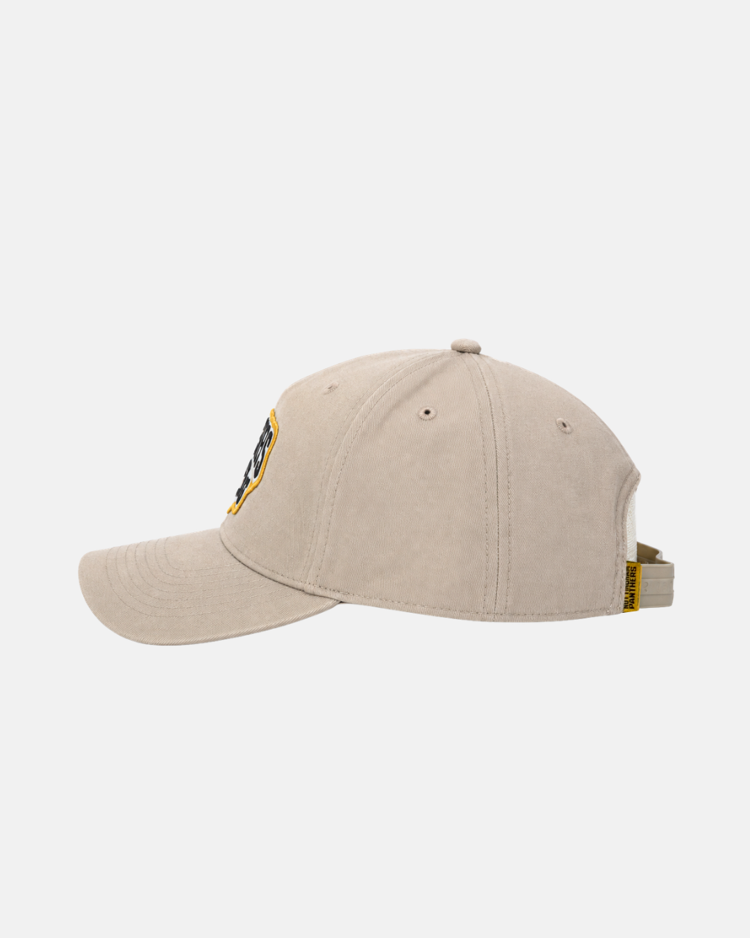 The Panthersland 26-27 Vintage Snapback is shown from the side in beige, with an adjustable strap at the back and a small yellow label. The cap features stitched eyelets and a partially visible embroidered patch on the front, giving it a subtle vintage A-frame look.