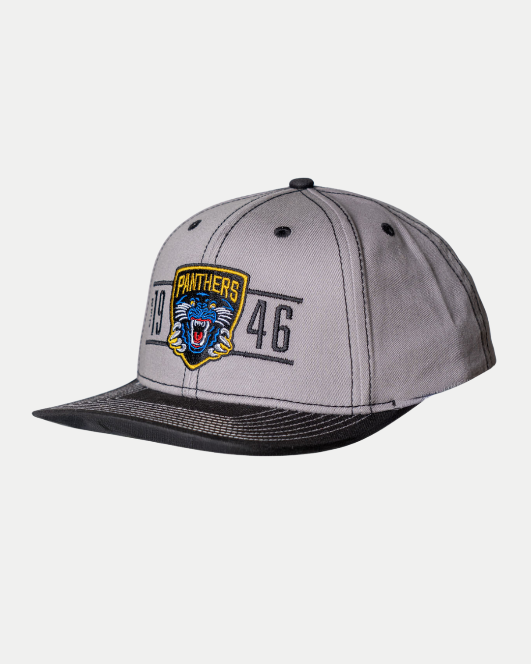 The Panthersland Nottingham Panthers 25-26 CCM Grey Flat Brim Snapback is a gray cap with a black brim, blue panther logo, "Panthers" text, and "1946" embroidered on the front.