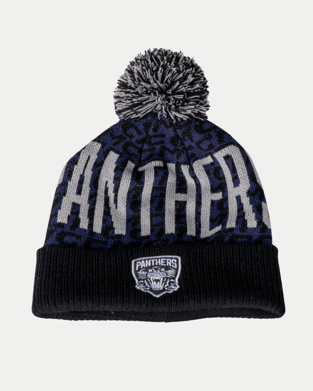 The Panthersland Nottingham Panthers 25-26 CCM Blue Black Pom Knit is a black and blue beanie with a pom-pom, "PANTHERS" lettering, and a front cuff patch showing a panther head and PANTHERS text.