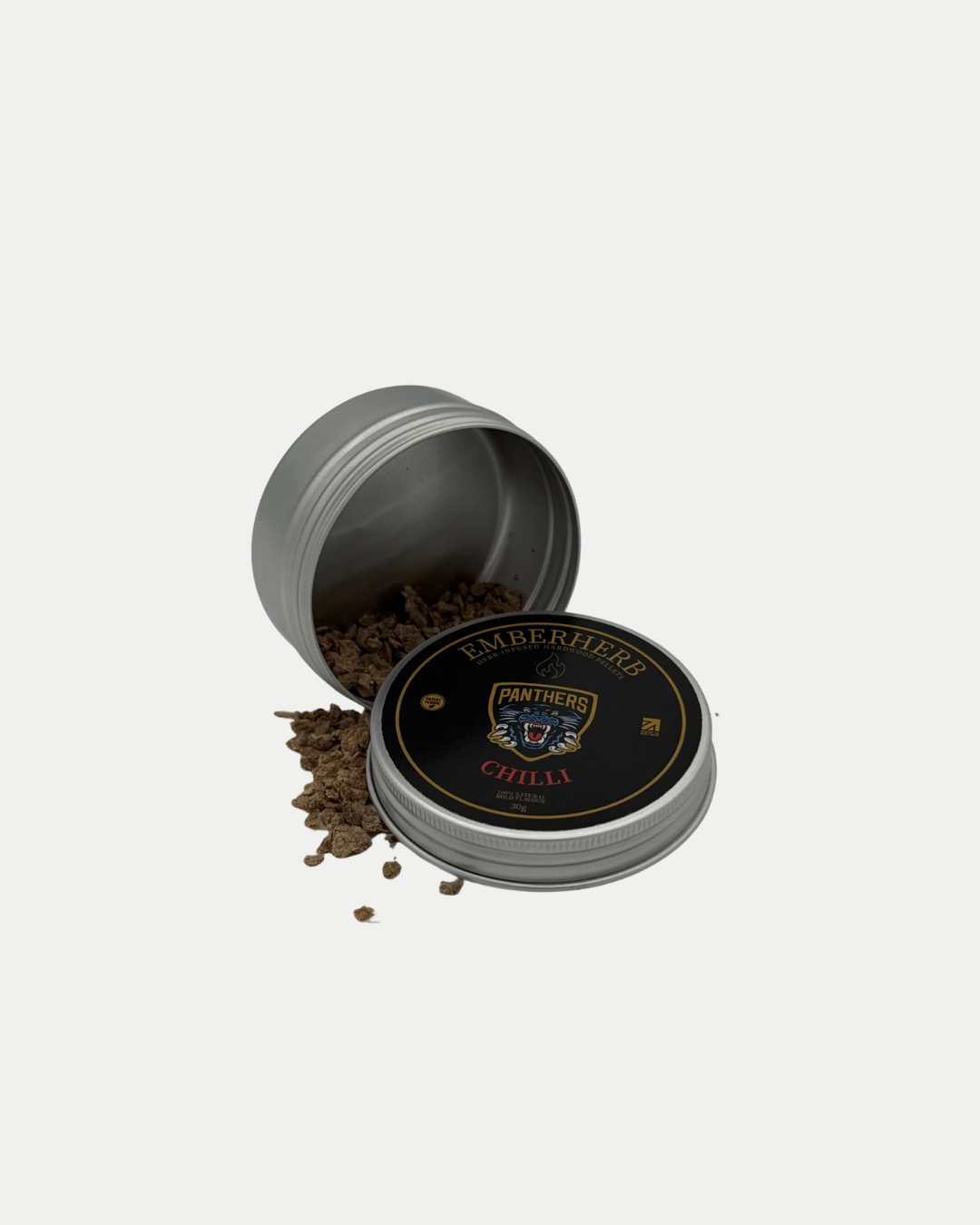 An open round metal tin labeled Panthersland Nottingham Panthers Whiskey Smoker Kit spills dry herbs onto a white surface—the perfect addition to your cocktail smoker kit or whisky infusion kit.