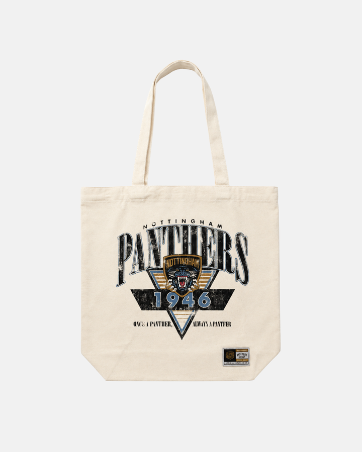 Introducing the Panthersland 26-27 Vintage Tote Bag: a beige canvas tote featuring the Nottingham Panthers logo, “1946,” and bold black “Nottingham Panthers” text. The front displays the classic Panthers crest with a panther emblem at its center, along with a small rectangular label on the bottom right. This stylish tote is perfect for fans who want to carry their essentials with pride.