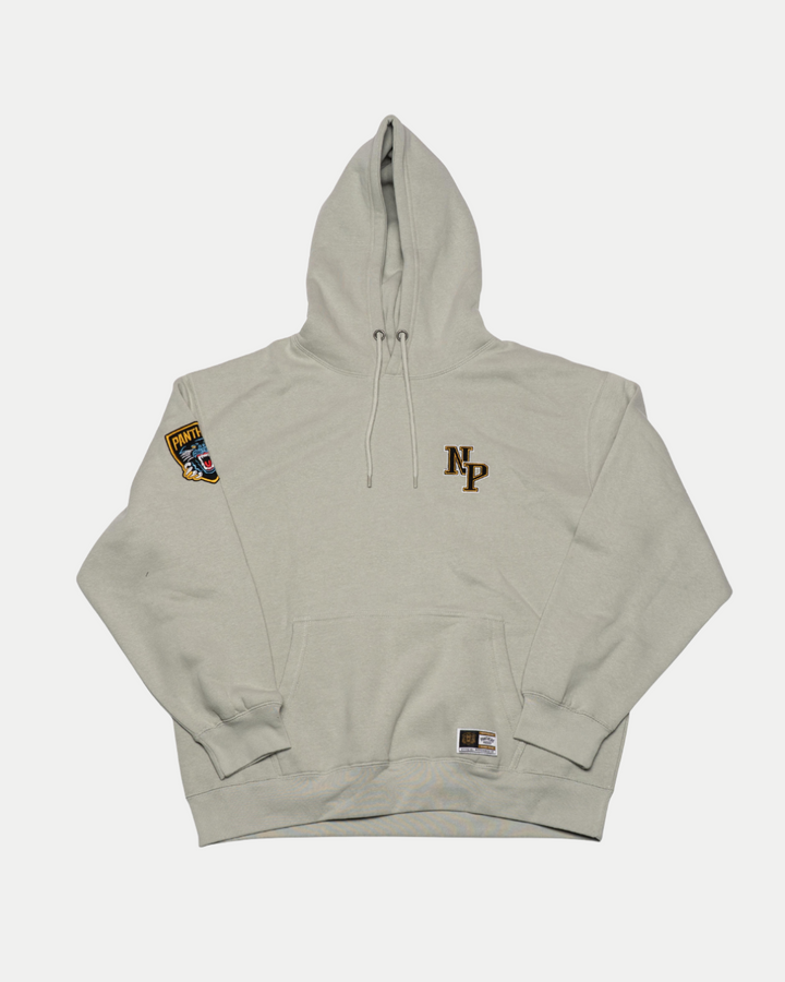 The Panthersland Nottingham Panthers 25-26 Grey NP Logo Hoodie features initials on the left chest, a colorful patch on the right shoulder, and a small label by the waistband—ideal for any Panthers fan. Laid flat on a white background.