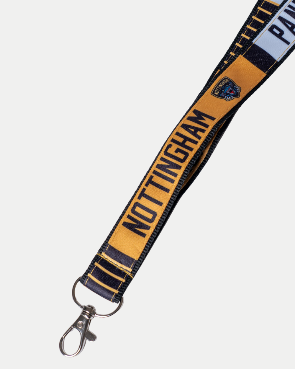 A close-up of the Nottingham Panthers Gold Lanyard by Panthersland, featuring gold and navy colors, "NOTTINGHAM" text, a small logo, and a metal swivel clasp.