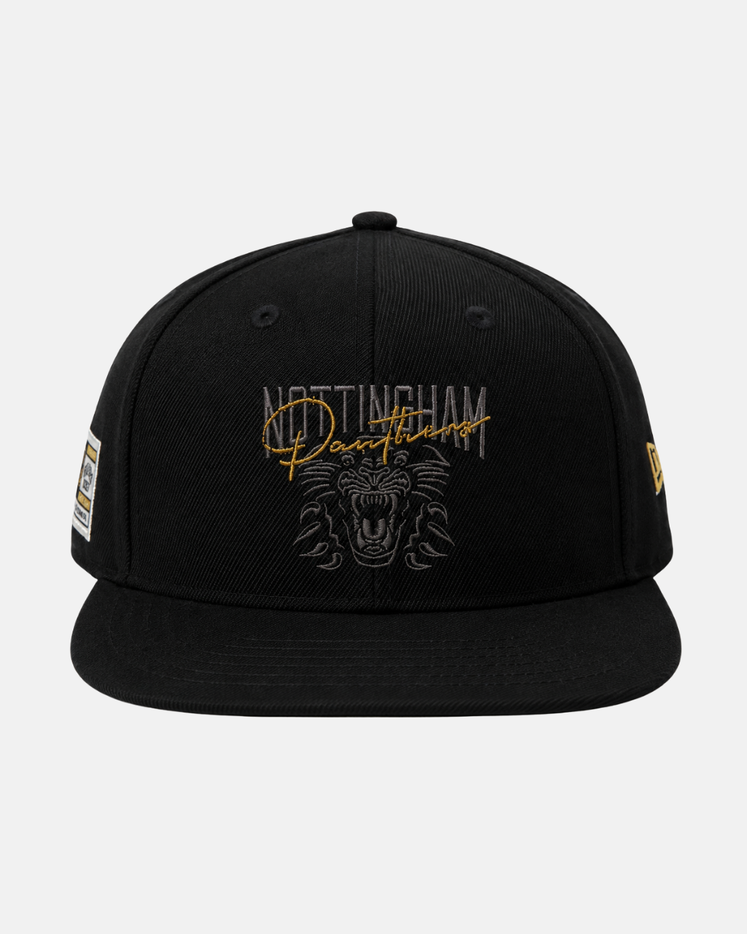 The Panthersland 26-27 Signature Snapback Cap is a black cap featuring Nottingham Panthers text and a bold crest logo embroidered on the front, with a New Era logo on the side and a sticker on the brim.