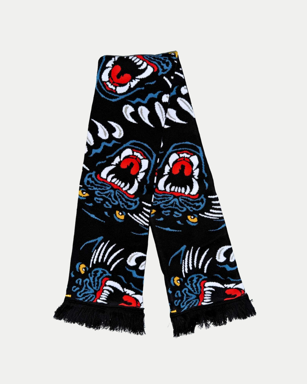 Show your team pride with the Panthersland 25-26 Multi Crest Scarf—a black scarf with fringed ends and a bold pattern of blue, red, white, and yellow roaring tiger heads.