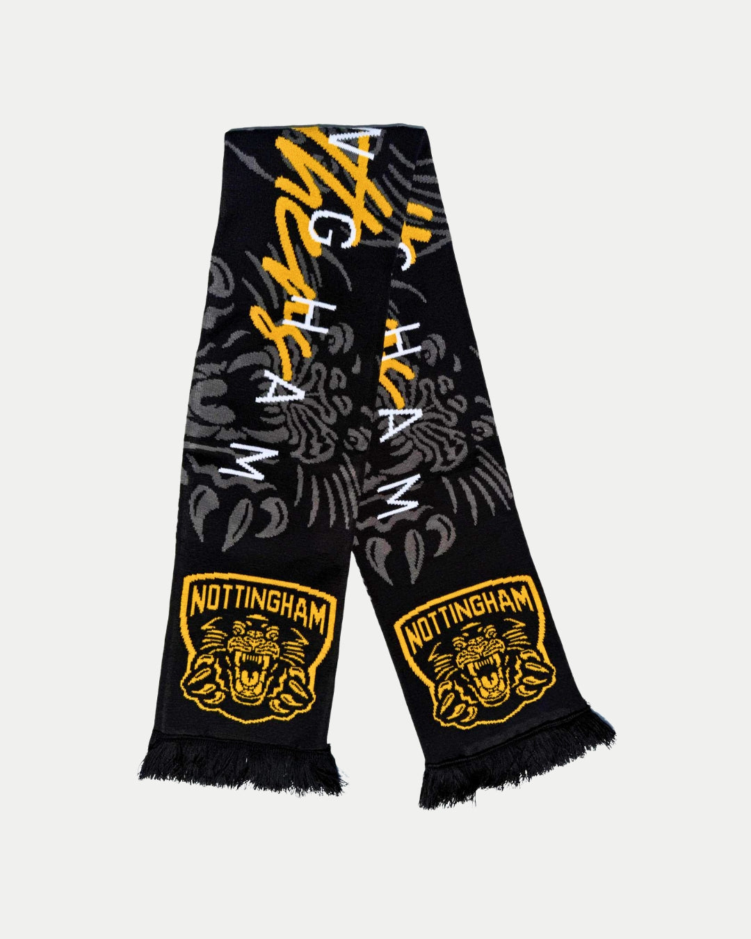 The Panthersland 25-26 Signature Scarf is black and yellow with NOTTINGHAM, roaring tiger logos, bold stripes, black fringes, and distinctive Panthers crests at both ends.