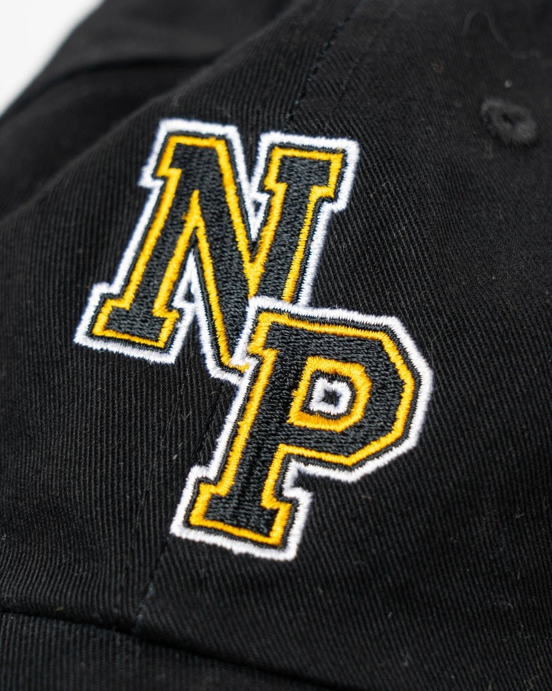 There are no keywords provided. Please provide one or two keywords to blend into the description for the NP Logo Black Cap by Nottingham Panthers.