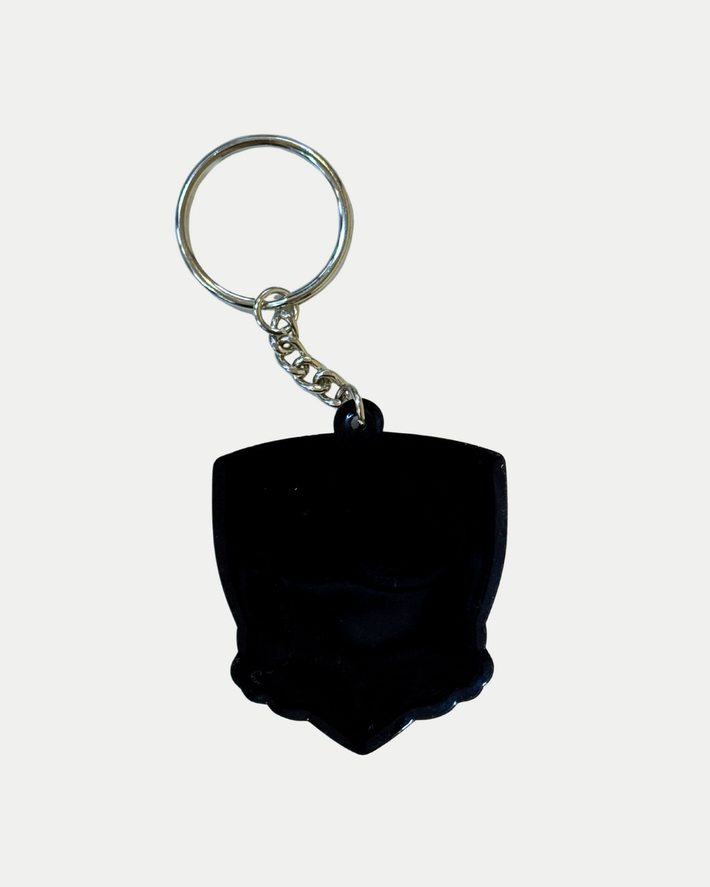 The Panthersland Nottingham Panthers PVC Keyring is a black, shield-shaped keyring with the team crest logo and a silver metal ring, shown on a plain white background.
