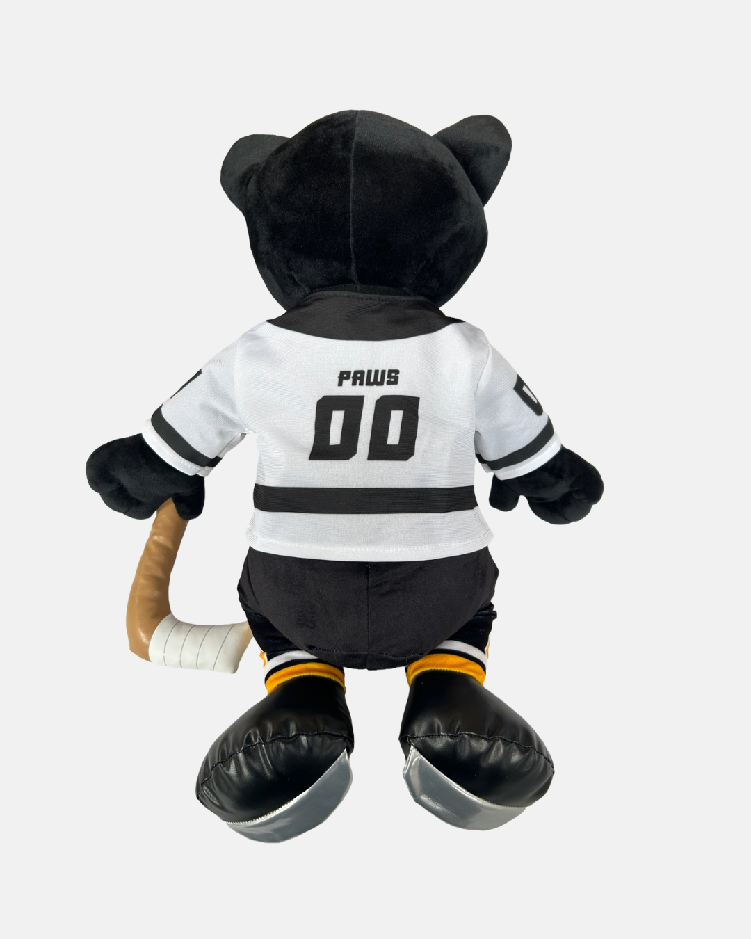 A Big Paws plush bear from Panthersland, dressed in a white Nottingham Panthers jersey with “PAWS 00” on the back and holding a hockey stick, is facing away from the camera—an ideal keepsake for dedicated Panthers fans.