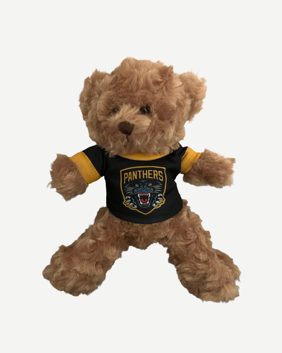 Plush teddy bear wearing a black shirt with a panther logo on a white background