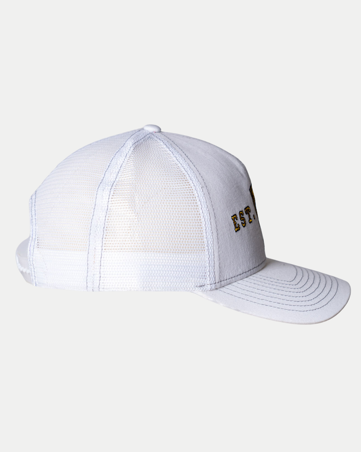 A side view of the Panthersland Nottingham Panthers 25-26 CCM White Mesh Back Trucker shows a light gray mesh trucker hat with a curved brim and partially visible black and gold embroidered text on the front panel.
