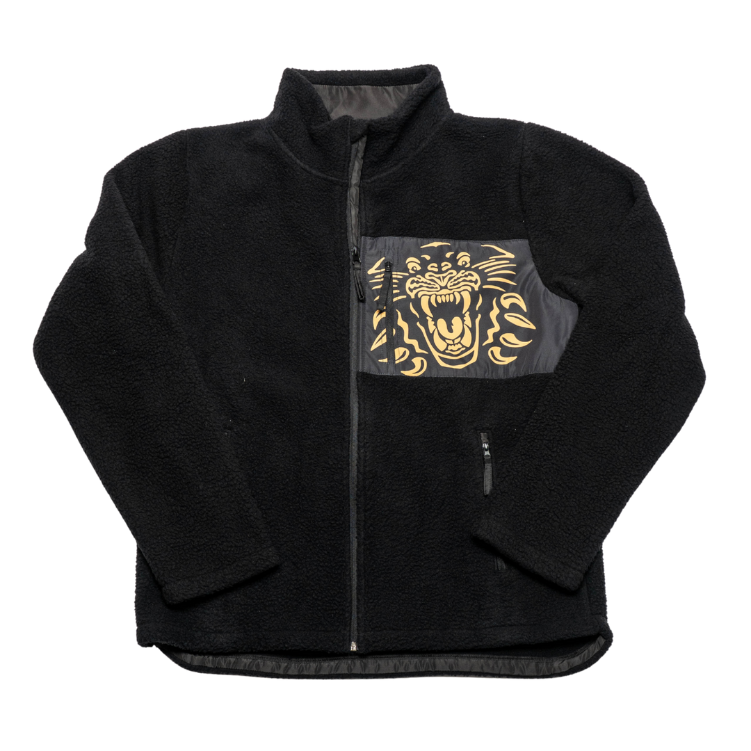The Panthersland Nottingham Panthers Pile Jacket Black/Gold Logo 25-26 features a cozy fleece texture, high collar, golden panther graphic on the left chest pocket, and convenient zippered side pockets.