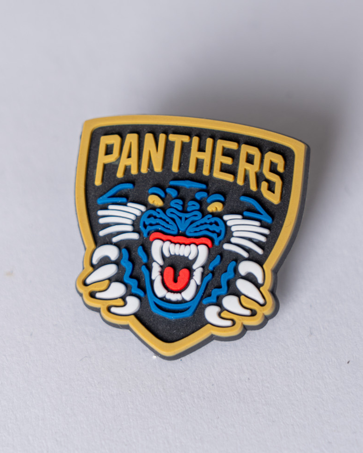 The Panthersland Nottingham Panthers Logo Croc Charm features the iconic roaring blue panther with white paws and fangs, yellow outline, and "PANTHERS" in bold yellow above, set on a black background.