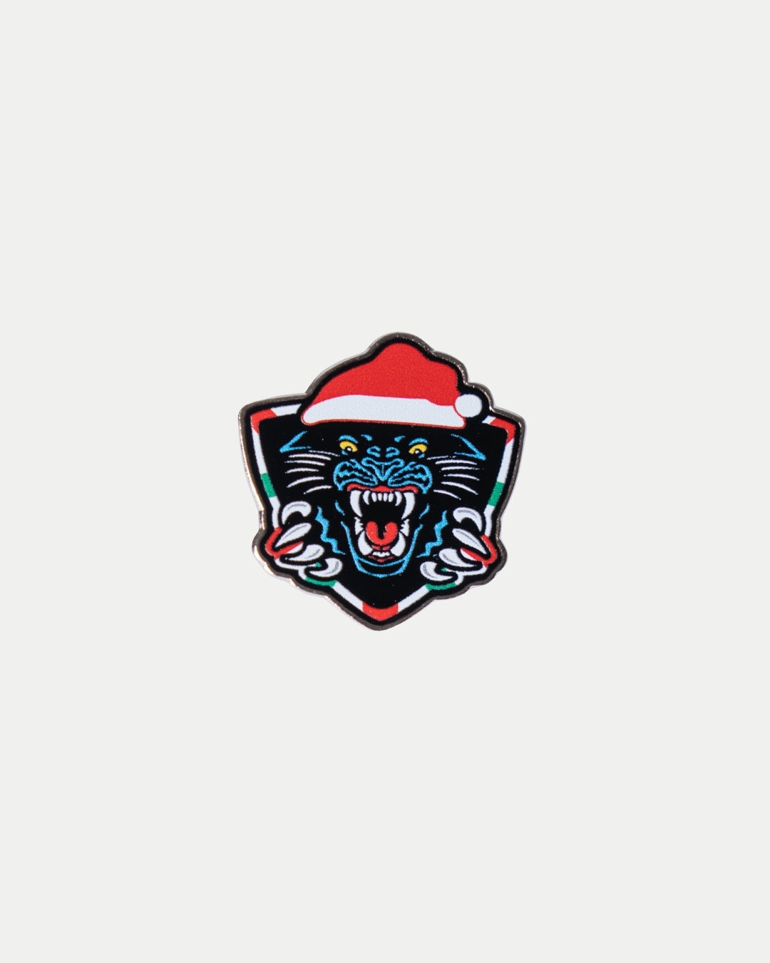 The Nottingham Panthers’ Santa Crest Pin features a roaring black panther mascot in a festive red and white Santa hat, set against a bold shield background on a crisp white surface.