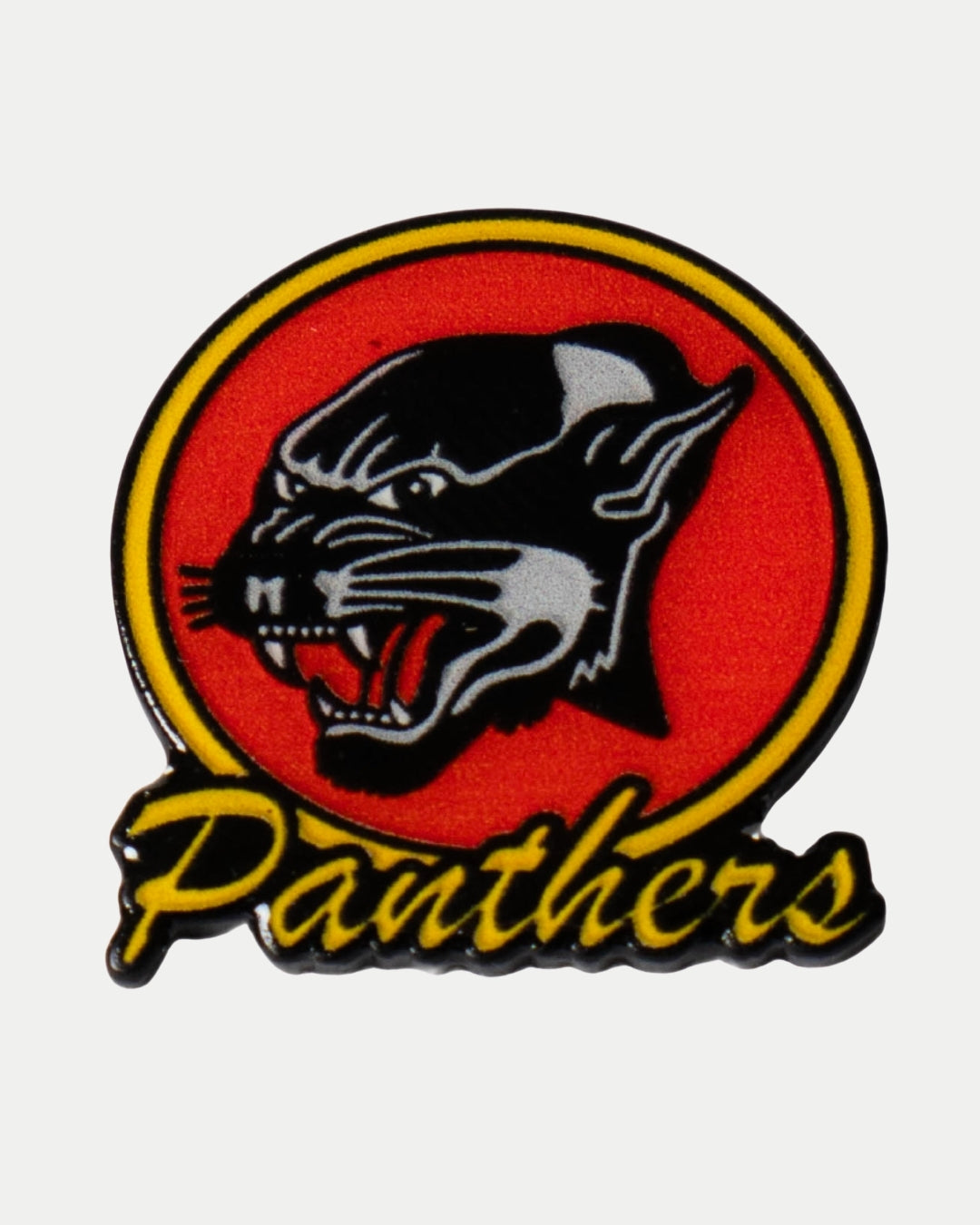 The Retro Logo Pin by Nottingham Panthers features a fierce black panther head with an open mouth inside a red circle outlined in yellow and black, with Panthers in bold yellow script below.