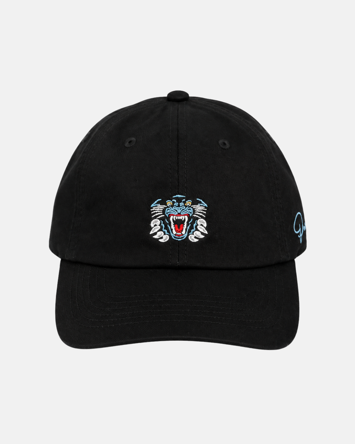 The Panthersland 26-27 Crest Dad Cap is a black baseball cap showcasing an embroidered roaring tiger face on the front with striking blue, white, and red accents. An embroidered crest logo embellishes the right side, while the adjustable clip closure ensures a comfortable fit. Set against a light gray background.