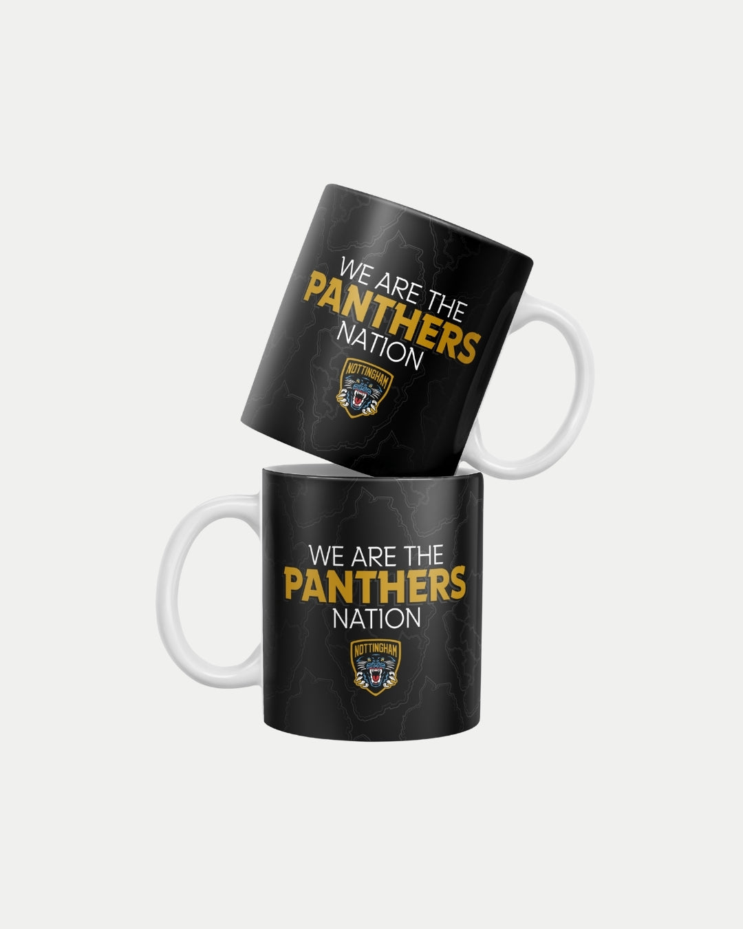 Two Panthers Nation Mugs by The Nottingham Panthers are stacked, featuring WE ARE THE PANTHERS NATION above a shield logo on black with lightning patterns. Made-to-order to reduce waste; delivery in 10-12 working days.