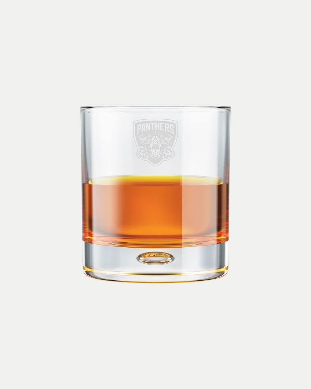The Nottingham Panthers Panthers Whiskey Glass features an etched panther head logo on clear glass filled with amber liquid, crafted to order and set against a plain light background.