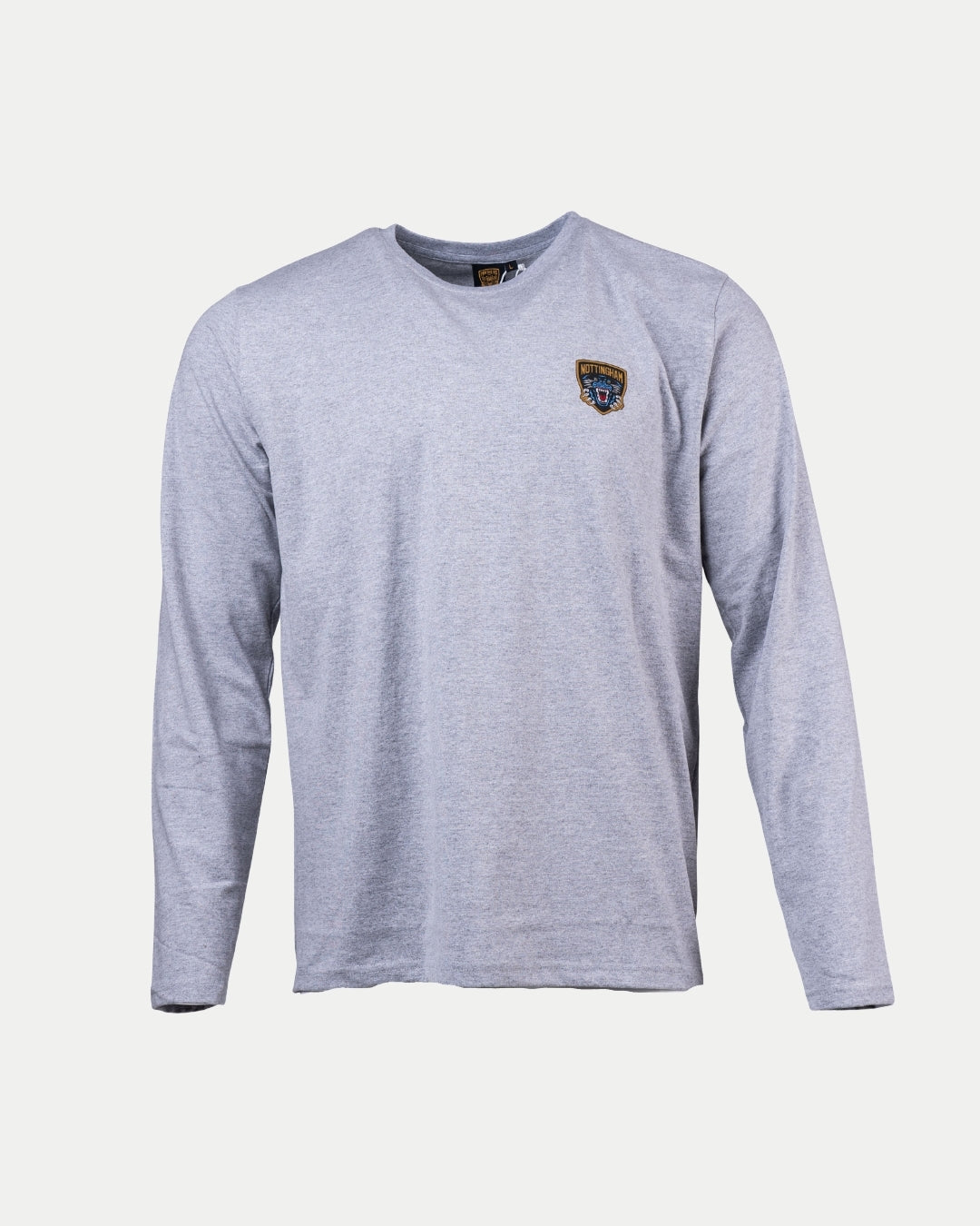 The Nottingham Panthers Logo Grey Long Sleeve features a small embroidered shield patch on the left chest, adding subtle style. The light gray shirt is shown against a plain white background.