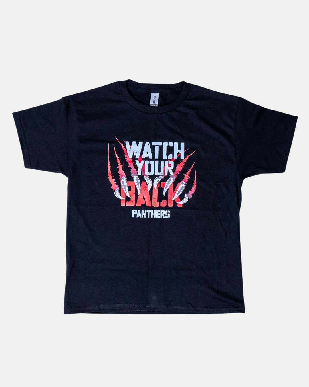 The Nottingham Panthers’ Watch Your Back Kids T-Shirt features “WATCH YOUR BACK” and “PANTHERS” in white and red on the front, with bold red claw marks slashing through “BACK”—a standout style for young fans.