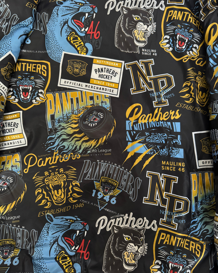 A patterned fabric inspired by the Panthersland 26-27 Vintage Varsity Jacket, featuring Nottingham Panthers hockey logos, snarling panther graphics, “NP,” and two hockey pucks in yellow, blue, and white on a dark background.