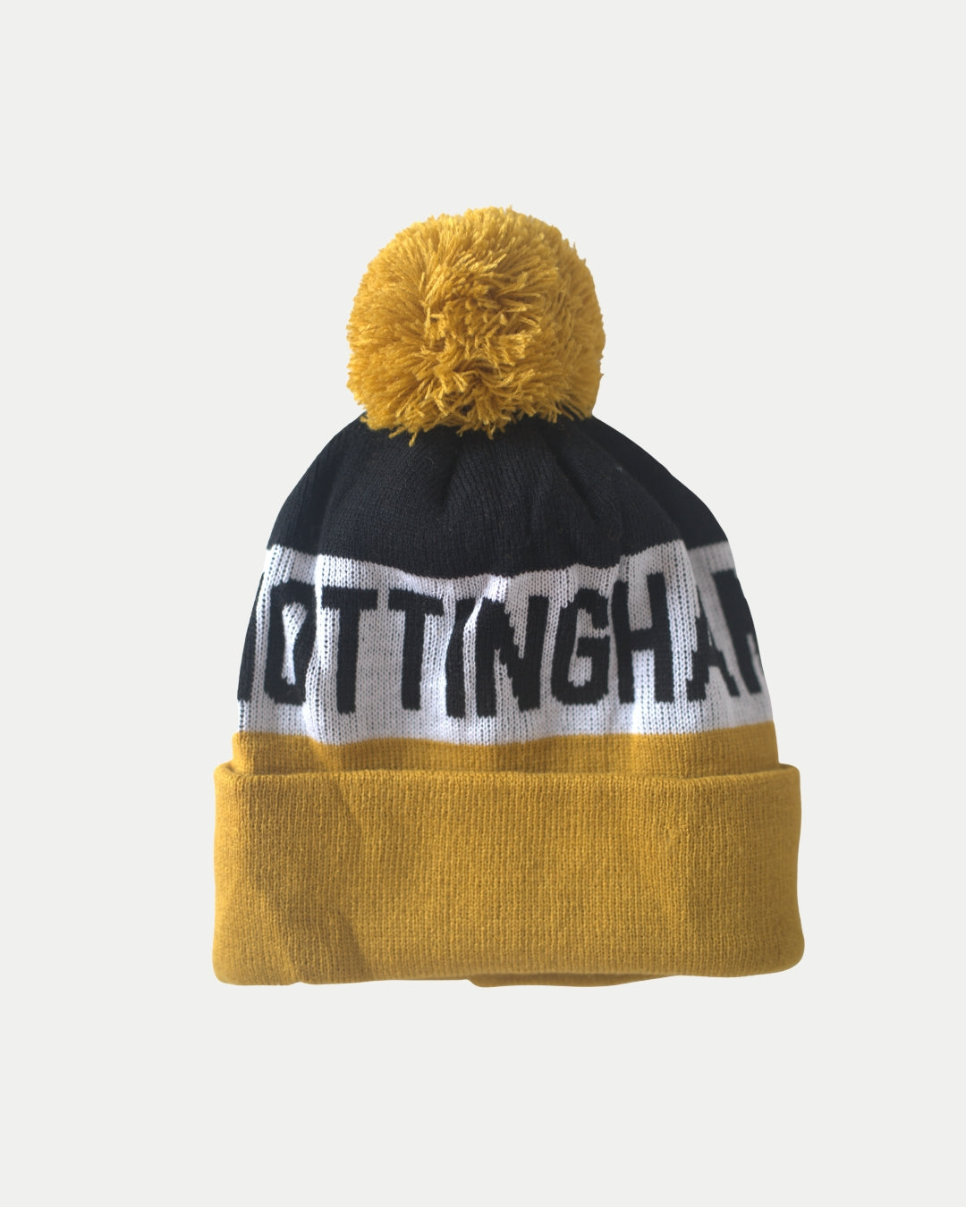 A yellow, black, and white City Text Pom Knit beanie by The Nottingham Panthers features a cheerful yellow pom-pom and NOTTINGHAM partly visible on the front.