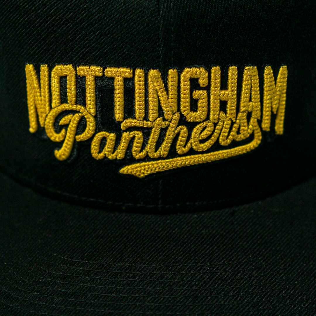 The Panthersland Nottingham Panthers 25-26 Script Snapback Cap is a black hat with bold gold embroidery of Nottingham Panthers across the front.