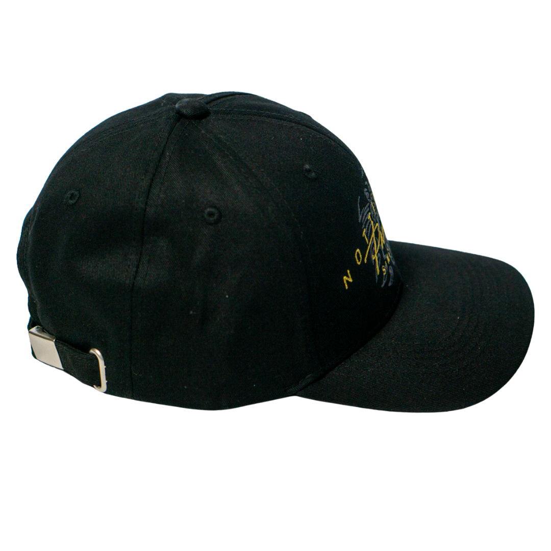 The Panthersland Nottingham Panthers Signature Cap 25-26 features a black design with a metal buckle on the adjustable strap, a slightly curved brim, and striking yellow and white embroidery on the front right side.