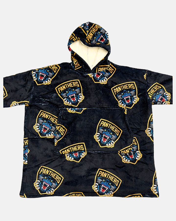Panthersland’s Nottingham Panthers Adult Sherpa Hoodie is a black hooded poncho featuring a repeating pattern of the roaring panther logo with “Panthers” on a gold shield. The interior has a beige lining that appears soft and cozy, resembling fleece.