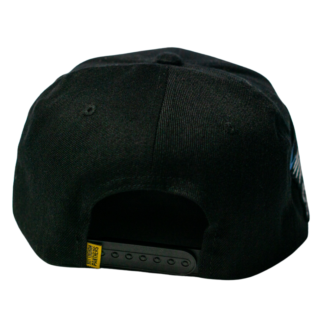 The Nottingham Panthers 25-26 Four Stripe Flatbrim Cap by Panthersland features a black design with an adjustable strap, subtle crest details, and a small yellow tag near the back.